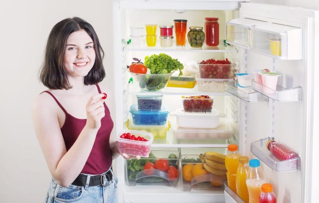 A flat lay of meal prep containers, perfect for discussing leftover utilization.